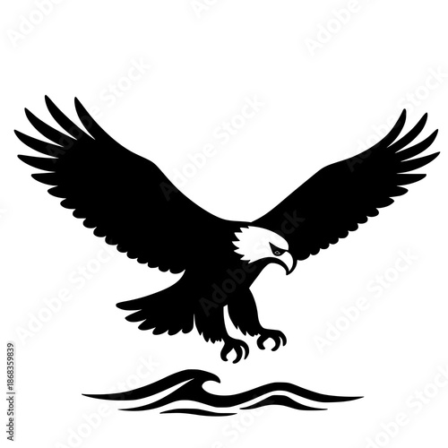 Majestic eagle in flight, poised to land on water