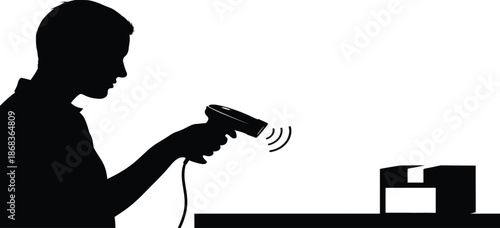 Silhouette of a person using a wireless scanner macine 