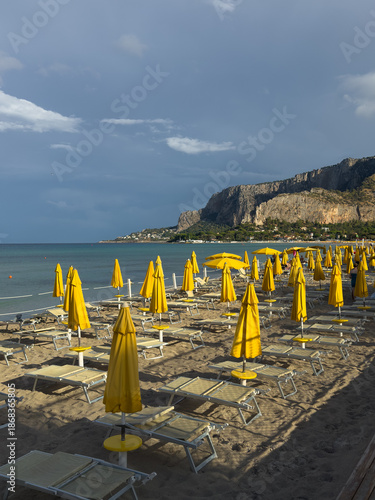 Yellow umbrellas on Mondello beach in Sicily