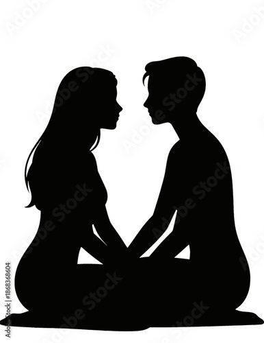 Silhouette of couple sitting close together.