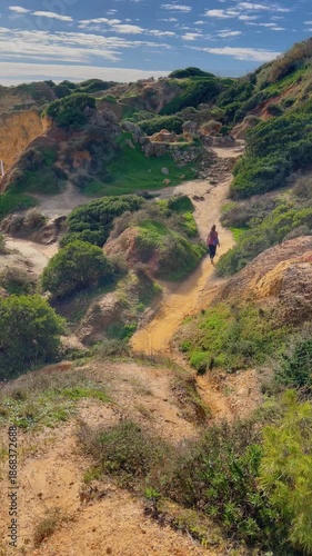 woman walking in beautiful wilderness landscape in Portugal, Algarve, Albufeira