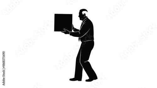 Silhouette of a businessman in formal attire carefully carrying a black rectangular box forward