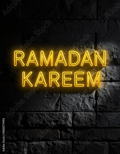Glowing Yellow Neon Sign Reads Ramadan Kareem Against a Dark Textured Brick Wall With Dramatic Lighting