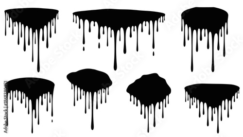 Abstract black paint drips forming an artistic pattern on a white background