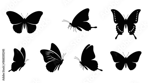 Collection of Black Silhouette Butterflies in Various Positions and Sizes for Design Projects
