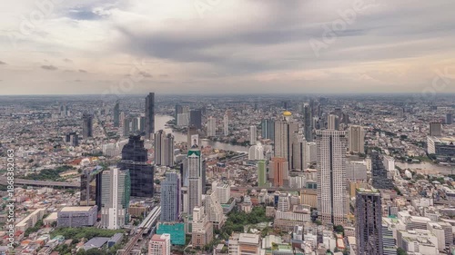 Night timelapse of Chao Phraya River, Bangkok with busy ferries and vibrant city skyline.