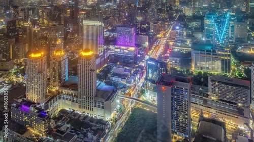 Aerial Night Timelapse of Ratchaprasong Intersection, Bangkok with Heavy Traffic.