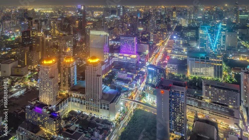 Aerial Night Timelapse of Ratchaprasong Intersection, Bangkok with Heavy Traffic.