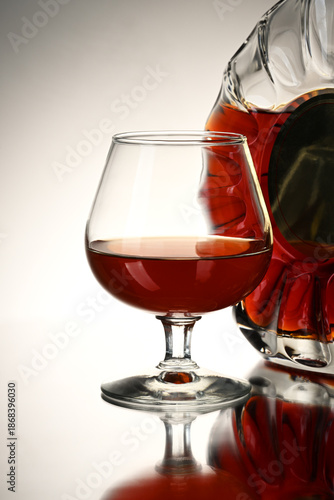 Glass and bottle with cognac
