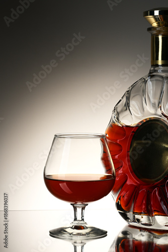 Glass and bottle with cognac