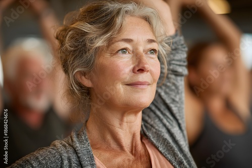 Wallpaper Mural Senior lady improving balance and mobility at an indoor fitness class, injury prevention Torontodigital.ca