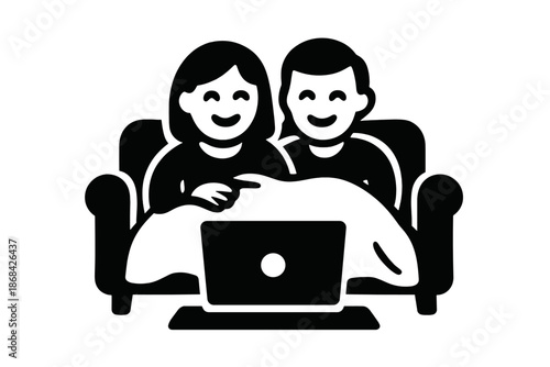 Happy couple relaxing together on a comfortable sofa watching streaming content on a laptop