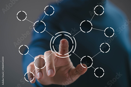 Hand touching central node of connected digital network interface. Concept of system integration, data connectivity, network structure, digital ecosystem, technology solution, information management.