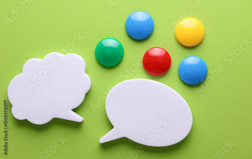 Different fridge magnets on a green background