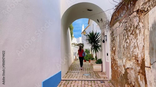woman traveling on the street in the old town of Albufeira in Portugal