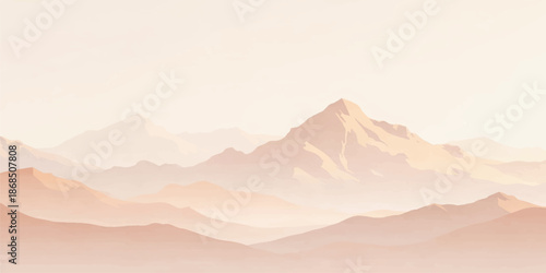 Panoramic mountain range landscape at sunrise with morning mist and fog veiling the peaks and valley under a glowing sky