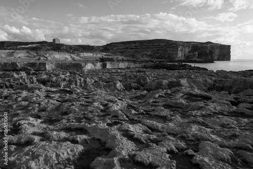 Traditional salt pans stretch along the coastline, combining stone basins, sea and rocky shore to illustrate historic salt harvesting at Saline, Malta, on 29 December 2025.