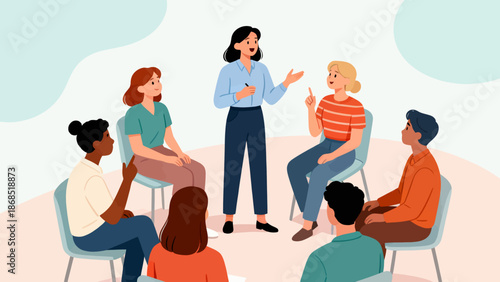 A group of people are sitting in chairs around a woman who is talking. The woman is giving a presentation or lecture to the group. The group of people are of different ages and genders
