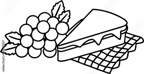 Grapes and cheesecake slice on checkered cloth, sweet dessert with fresh fruit