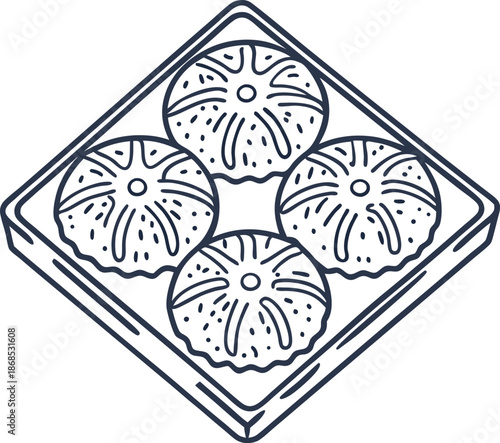 Traditional indian sweets in a box four round dessert pieces with detailed decoration, festive treat