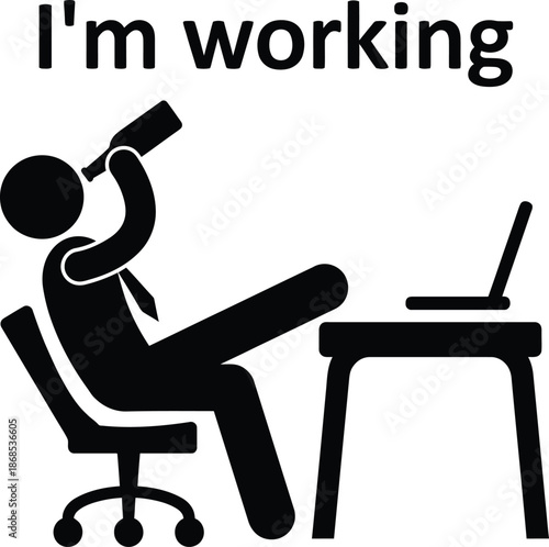 Man drinking alcohol while working on laptop