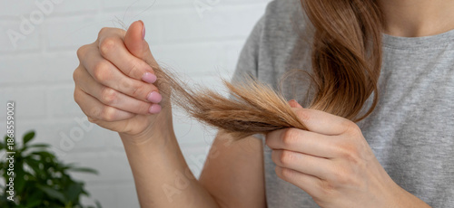 Photography Woman looking at fallen hair in her hand