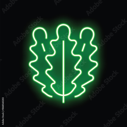 Green neon sign in the shape of an oak leaf, glowing on a black background