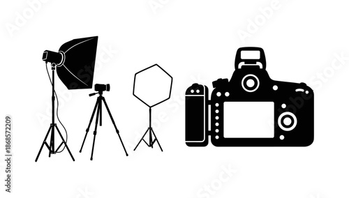 Professional photography equipment set with silhouette camera and studio lighting setup