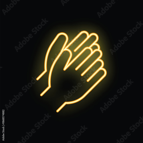 Neon sign showing two hands clapping making a warm bright yellow glow