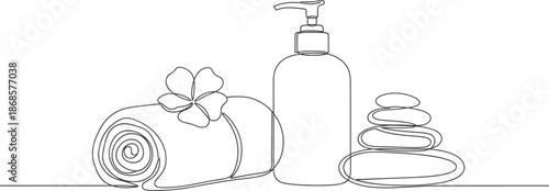 Spa essentials for relaxation and wellness with towel and stones