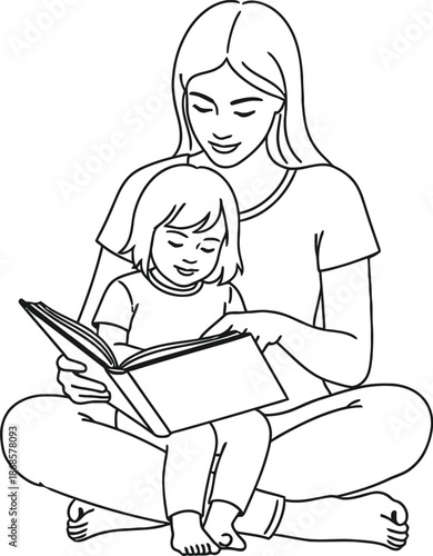 Mother reading a book to her child sitting cross legged on the floor