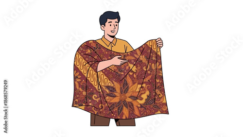 Man holding a piece of traditional Indonesian batik fabric with intricate floral patterns