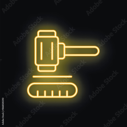Yellow neon glowing auction or judge gavel striking down on black background