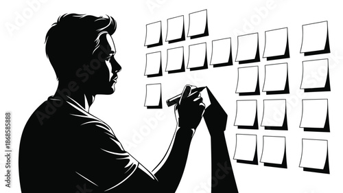 Close up of a male silhouette writing with a marker on various blank notes attached to a white wall