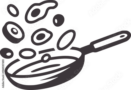 Dark gray frying pan with food flying out cooking breakfast
