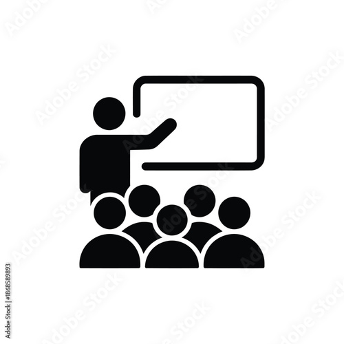 A presentation with a speaker addressing an audience in a classroom