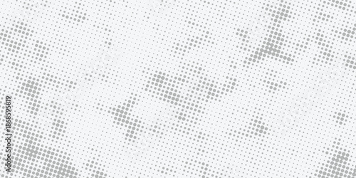 Abstract gray halftone dot pattern background with a subtle gradient, ideal for modern design, print materials, and digital textures.