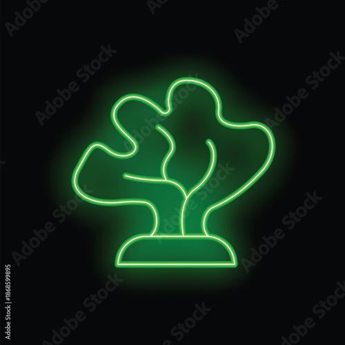 Green neon sign representing a plant growing on a small surface on a black background