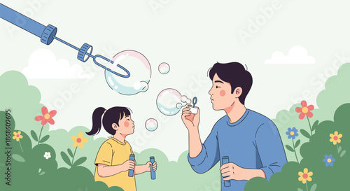 Happy father and his young daughter having fun blowing soap bubbles together in a garden filled with flowers on a beautiful day.