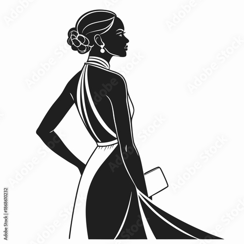 Elegant woman in profile showcasing a sophisticated updo and flowing dress design