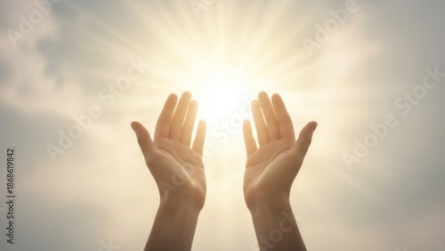 Woman hands reaching up to bright sun rays. Hope concept for spirituality, religion, and freedom. Open palms worshiping, praying, or blessing symbol
