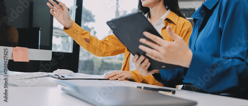 Meeting, tablet and business people in office for discussion, collaboration or planning project. Teamwork, feedback and employees talking for product development, conversation or idea at design firm