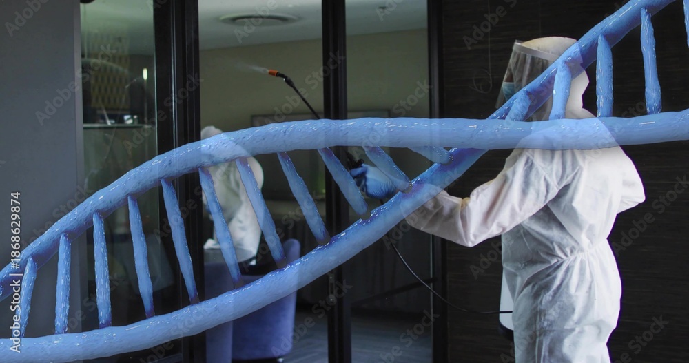 Naklejka premium Spraying worker in white coverall holding spray wand and DNA graphic near glass door, copy space