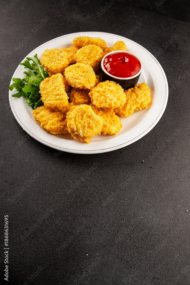 Naklejka premium Chicken nuggets fast food natural tasty appetizer fresh delicious gourmet food background on the table rustic top view copy space