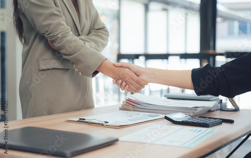 Tableau sur toile Handshake of Partnership: A close-up shot capturing a pivotal moment of agreement and collaboration with an extended handshake in a professional environment, symbolizing partnership