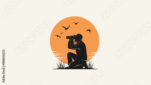 Silhouette of a person observing wildlife with binoculars at sunset.