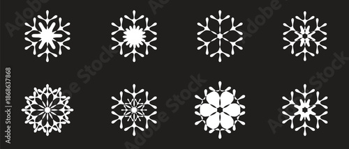 White snowflake icon set with detailed winter crystal shapes on dark background. Symmetrical frozen designs represent cold weather, ice patterns, and seasonal decoration. Ideal for winter themes, 