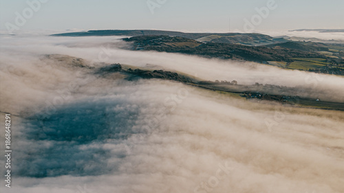 Photos The sky is covered in fog and the mountains are in the background
