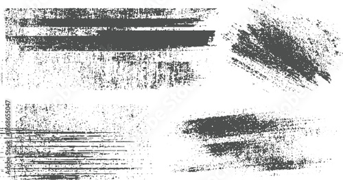 Four distinct dark gray grunge brush stroke textures with a distressed and rough appearance on a clean white background and artistic overlays