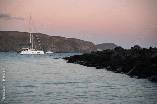 A white yacht sailing out to sea